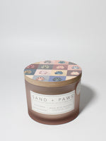 Sand + Paws California Beach House 12 oz scented candle Blush vessel with Painted Paw Grid lid